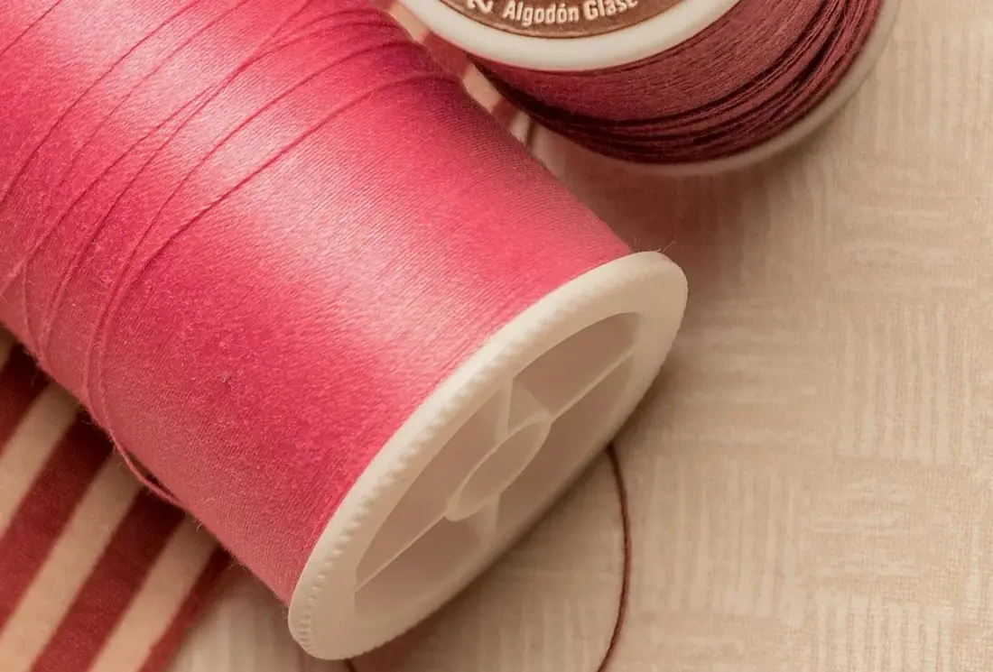 Spool of bright pink thread