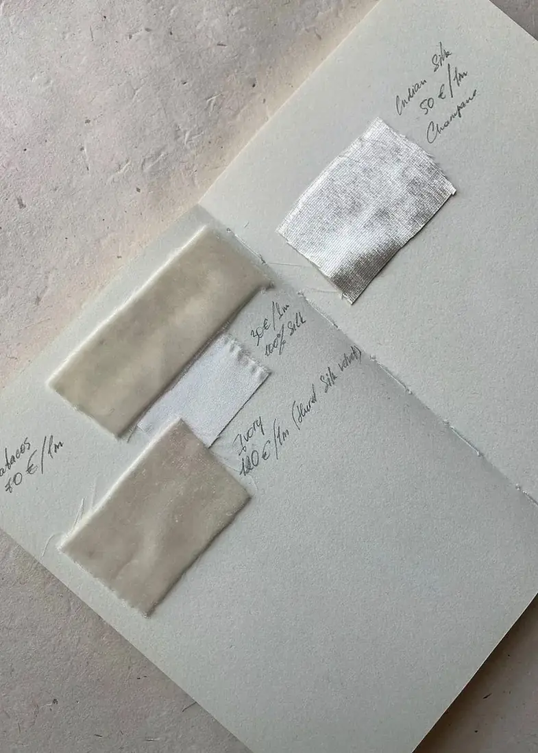 Open notebook with fabric swatches attached